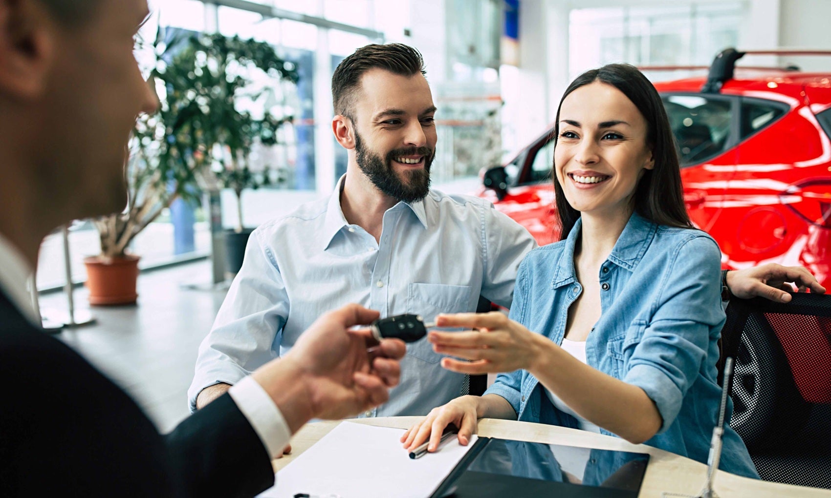 Couple buying a pre-owned vehicle